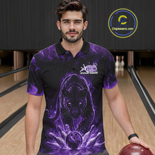 Load image into Gallery viewer, Front view of a male model in a bowling lane wearing a black polo shirt with glowing purple electric panther and energetic bowling strike illustration.