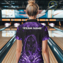 Load image into Gallery viewer, Back view of a female model in a bowling lane wearing a black polo shirt featuring glowing purple electric panther design with bowling ball crashing through pins visuals.