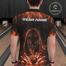 Load image into Gallery viewer, Back view of a male model in a bowling lane wearing a black polo shirt featuring glowing orange electric panther design with bowling strike action artwork.