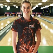 Load image into Gallery viewer, Front view of a female model in a bowling lane wearing a black polo shirt with glowing orange electric panther and bowling ball striking pins illustration.