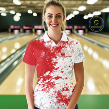 Load image into Gallery viewer, Female model front view in bowling lane wearing white polo shirt with red and white splatter pattern, sporty bowling alley scene