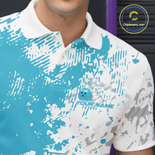 Load image into Gallery viewer, Close-up view of the left chest of a teal blue and white splatter bowling polo shirt showing abstract modern bowling-inspired graphics.