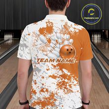 Load image into Gallery viewer, Back view of a male model in a bowling lane wearing an orange and white splatter bowling polo shirt with clean sporty bowling-inspired graphics.