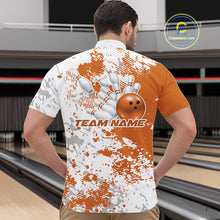 Load image into Gallery viewer, Male model in a bowling lane wearing a quarter zip shirt, front view showcasing orange and white splatter background with bold abstract sportswear styling