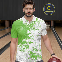 Load image into Gallery viewer, Front view of a male model in a bowling lane wearing a green and white splatter polo shirt with minimalist bowling-themed design accents.