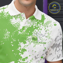 Load image into Gallery viewer, Close-up view of the left chest of a green and white splatter polo shirt showing clean abstract bowling-inspired design detail.