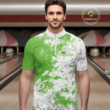 Load image into Gallery viewer, Male model in a bowling lane wearing green and white quarter zip shirt, front view showcasing splatter pattern with clean abstract bowling-inspired styling