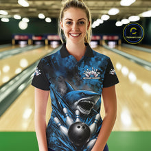 Load image into Gallery viewer, Woman wearing a blue and black bowling shirt with a shark design in a bowling alley.
