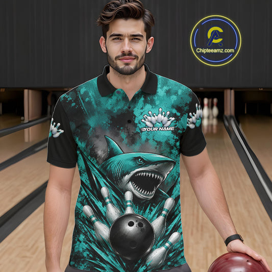 Man wearing a teal bowling shirt with shark design in a bowling alley.