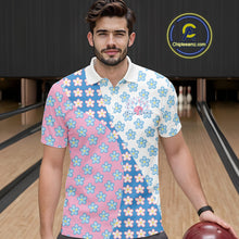 Load image into Gallery viewer, Front view of a male model in a bowling lane wearing a white polo shirt with white, blue and pink floral pattern and elegant sporty graphics.