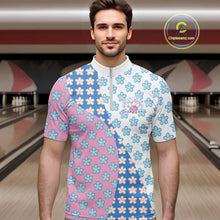 Load image into Gallery viewer, Male model in a bowling lane wearing a quarter zip shirt, front view featuring white, blue, and pink floral pattern with soft artistic styling