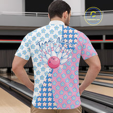 Load image into Gallery viewer, Male model at a bowling lane wearing a quarter zip shirt, front view showcasing white, blue, and pink floral pattern with elegant textile design