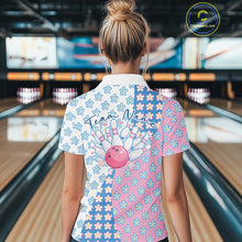Load image into Gallery viewer, Back view of a female model in a bowling lane wearing a white quarter-zip shirt featuring white, blue and pink floral pattern with refined decorative styling.