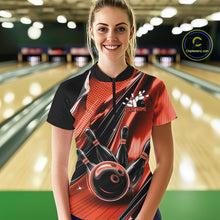 Load image into Gallery viewer, Female model wearing a black and orange bowling quarter-zip shirt at the lane with dynamic bowling ball and pin artwork.