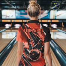 Load image into Gallery viewer, Back view of a female model in a black and orange bowling quarter-zip shirt displaying bowling-themed speed streak graphics.