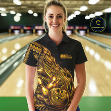 Load image into Gallery viewer, Female model wearing a black and gold bowling polo shirt at the lane with Polynesian-inspired flame bowling motifs.