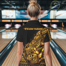 Load image into Gallery viewer, Back view of a female model in a black and gold bowling polo shirt showcasing tribal bowling artwork with flowing flame accents.