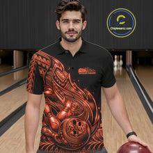 Load image into Gallery viewer, Male model wearing a black and orange bowling polo shirt at the bowling lane with tribal flame bowling artwork.