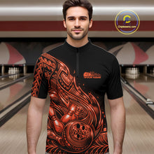 Load image into Gallery viewer, Male model wearing a black and orange bowling quarter-zip shirt at the lane with Polynesian-style tribal flame bowling graphics.
