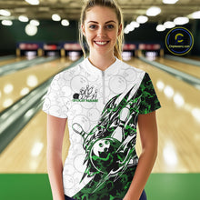 Load image into Gallery viewer, Female model wearing a white bowling quarter-zip shirt at the lane with green camo bowling graphics and subtle bowling ball patterns.