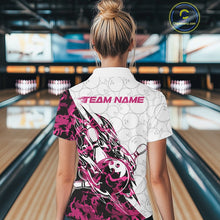 Load image into Gallery viewer, Back view of a female model in a white bowling polo shirt featuring pink camo streak accents and bowling motifs.