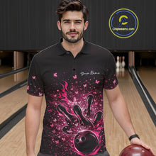 Load image into Gallery viewer, Male model wearing a black and pink bowling polo shirt at the lane with flaming ball and butterfly artwork.