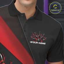 Load image into Gallery viewer, Close-up view of the left chest area of a black and red bowling polo shirt showing a flame bowling ball and pins design detail.