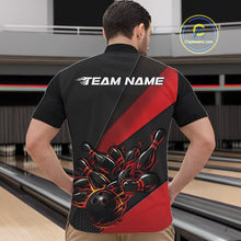 Load image into Gallery viewer, Front view of a male model in a bowling alley wearing a black and red quarter zip with fiery bowling ball striking pins in dynamic motion artwork.