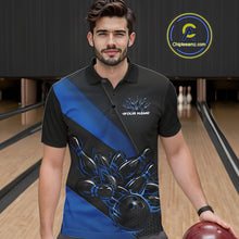 Load image into Gallery viewer, Male model seen from the front in a bowling lane wearing a black and blue polo shirt featuring a flame bowling ball striking pins in a dynamic sports action scene.