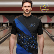 Load image into Gallery viewer, Male model front view inside a bowling center wearing a black and blue quarter zip shirt, featuring a flaming bowling ball knocking down pins in vivid motion graphics.