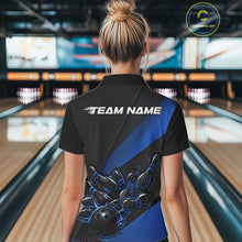 Load image into Gallery viewer, Back view female model at bowling lane wearing black and blue quarter zip shirt featuring flaming bowling ball striking pins illustration