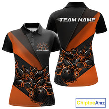 Load image into Gallery viewer, Front and back mockup of women’s black and orange polo shirt featuring flame bowling ball striking pins in bold, energetic sports apparel artwork.