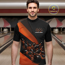 Load image into Gallery viewer, Male model in a bowling venue front view wearing a black and orange quarter zip shirt with a fiery bowling ball hitting pins in energetic bowling action artwork.