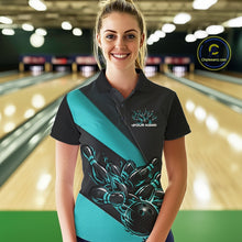 Load image into Gallery viewer, Female model front view at bowling lane wearing black and turquoise blue polo shirt with flaming bowling ball hitting pins in dynamic sports scene.
