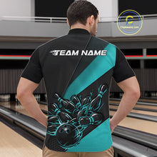 Load image into Gallery viewer, Front view of a male model at the bowling lane wearing a black and turquoise quarter zip, showcasing a fiery bowling ball hitting pins in a bold sports-themed artwork.