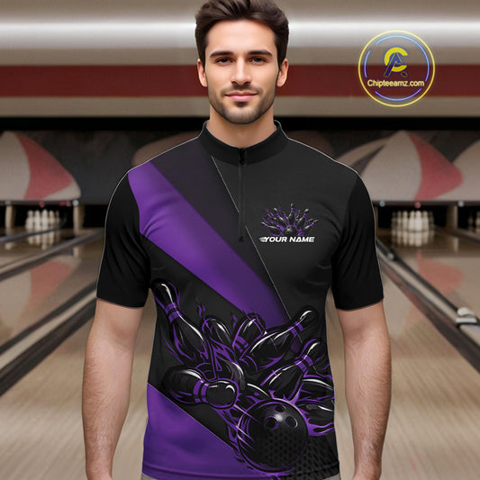 Male model front view inside bowling venue wearing black and purple quarter zip shirt showcasing flame bowling strike artwork