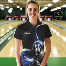 Load image into Gallery viewer, Female model in a bowling lane wearing a black and blue polo shirt with honeycomb texture and a heart-framed bowling strike graphic.
