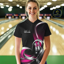 Load image into Gallery viewer, Female model wearing a black and pink bowling quarter zip shirt in a bowling alley, showing a honeycomb pattern with a heart surrounding a black bowling ball and pins.