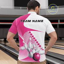 Load image into Gallery viewer, Male model in a bowling alley wearing a white and pink quarter zip shirt with flowing geometric stripes and a bowling ball striking pins design.