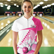 Load image into Gallery viewer, Female model wearing a white and pink bowling quarter zip featuring flowing geometric stripe artwork and a dynamic bowling strike motif at the bowling lane.