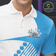 Load image into Gallery viewer, Close-up of the left chest area of a white and light blue bowling polo shirt, featuring asymmetric wavy geometric stripe design with bowling action graphic.