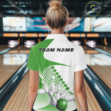 Load image into Gallery viewer, Back view of a female model in a bowling venue wearing a white and green polo shirt, showcasing asymmetric stripe patterns and a dynamic bowling action design.