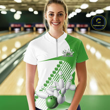Load image into Gallery viewer, Female model at the bowling lane wearing a white and green bowling quarter zip with asymmetric wavy stripes and dynamic bowling strike artwork.