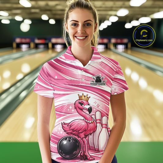 Female model wearing a pink bowling polo shirt at a bowling lane with a crowned flamingo, bowling ball, and bowling pin artwork.