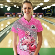 Load image into Gallery viewer, Female model at a bowling lane wearing a pink bowling polo shirt with an elegant flamingo, cocktail, and bowling ball design.