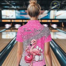 Load image into Gallery viewer, Back view of a female model in a bowling alley wearing a pink quarter-zip bowling shirt featuring an elegant flamingo beside a bowling ball.