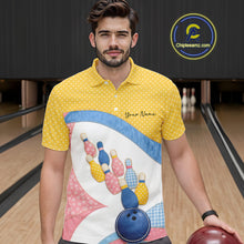 Load image into Gallery viewer, Male model at a bowling lane wearing a bowling polo shirt with vibrant patchwork bowling ball and pin graphics accented by polka dots.