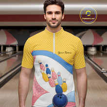 Load image into Gallery viewer, Male model at a bowling lane wearing a quarter-zip bowling shirt with vibrant patchwork bowling ball and pin graphics accented by polka dots.