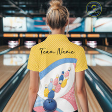 Load image into Gallery viewer, Back view of a female model wearing a bowling quarter-zip shirt showcasing colorful bowling-themed patchwork graphics and polka dot details.
