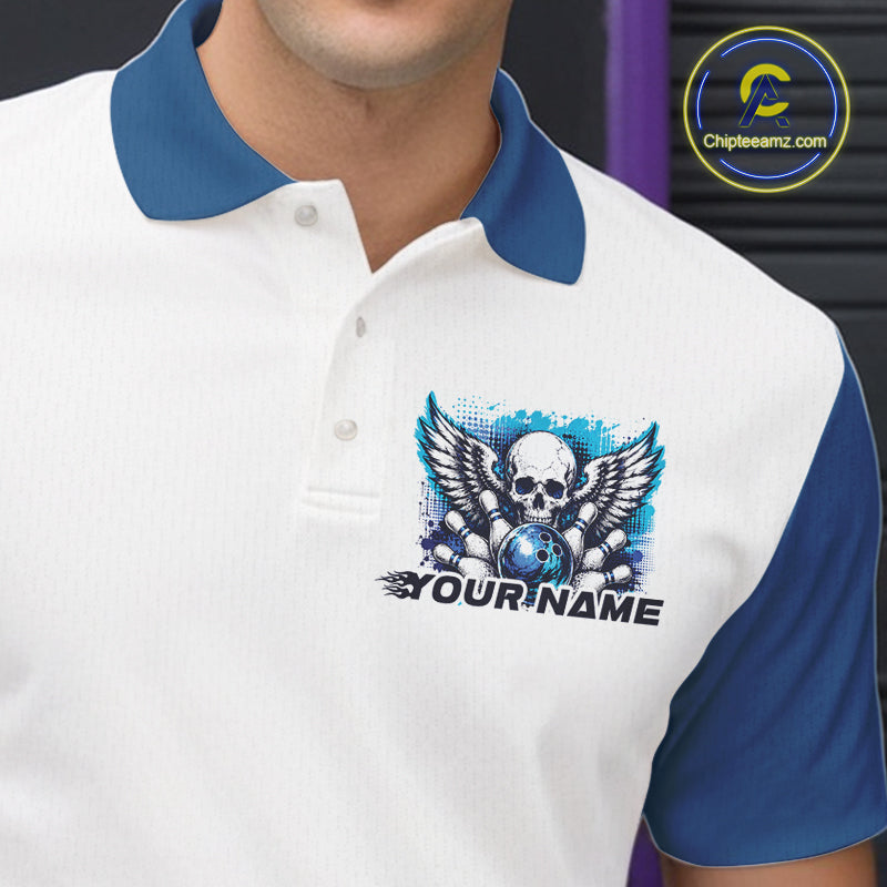 Close-up view of the left chest on a bowling polo shirt featuring a gothic winged skull design with a bowling ball and bowling pins in a white and blue color scheme.
